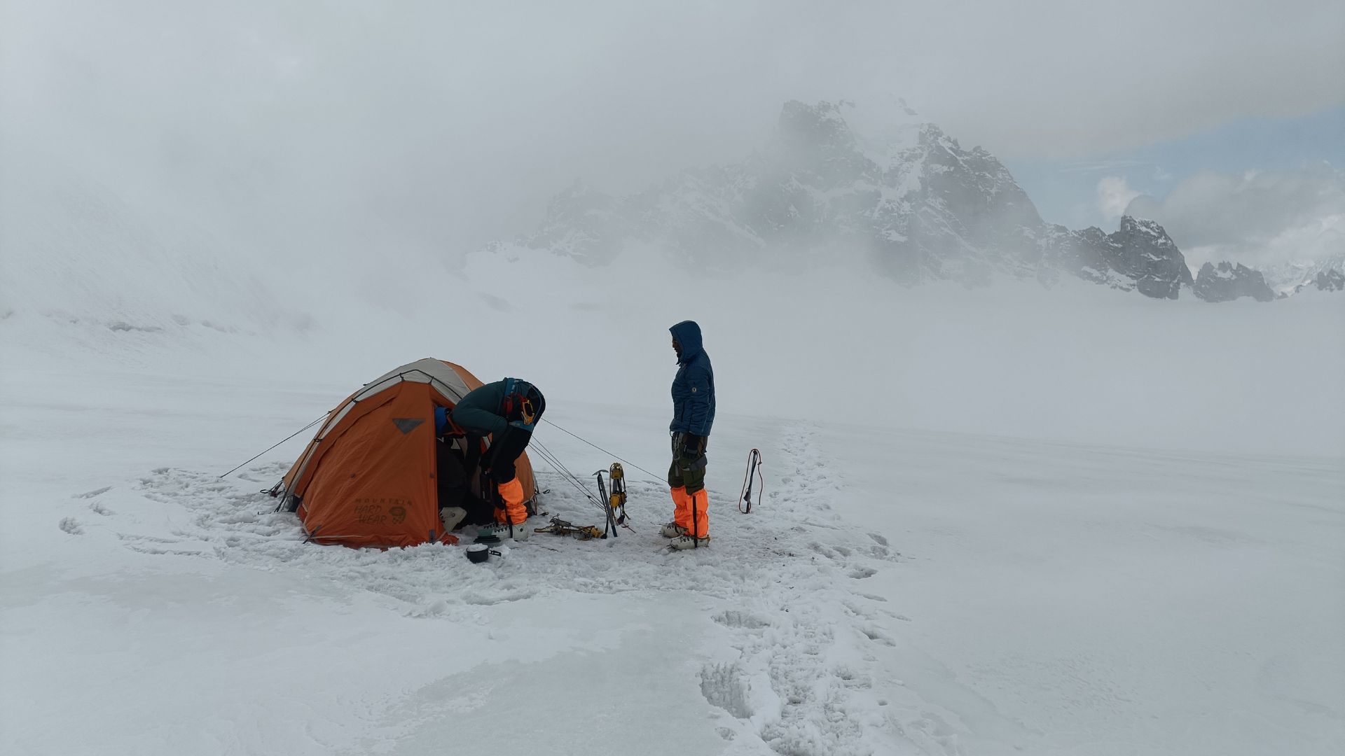 a guy standing in snow